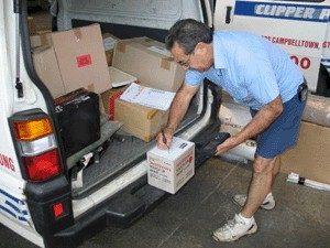 Clipper Parcels courier loading van with parcels